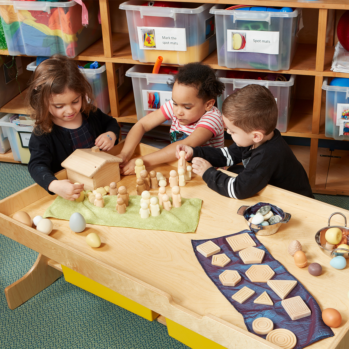 Child-height table with shelf for sensory play