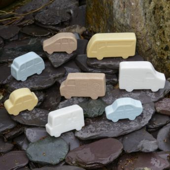 Set of 8 different vehicles made of stone and resin