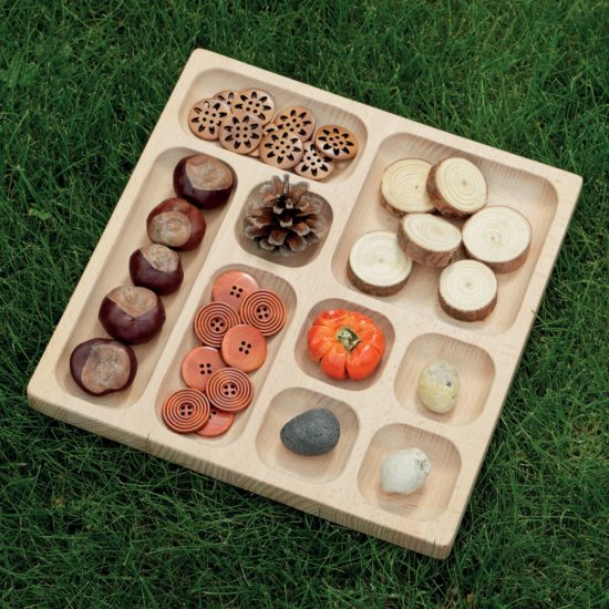 Wooden tray with different-sized sections for collecting items