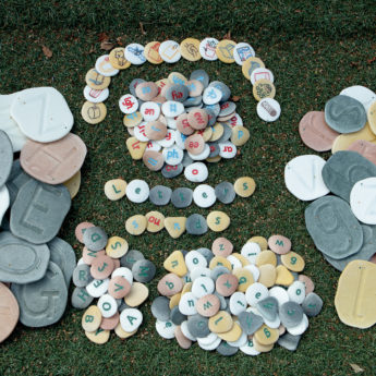 Tactile letter pebbles for phonics and word-building outdoors