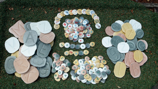 Tactile letter pebbles for phonics and word-building outdoors