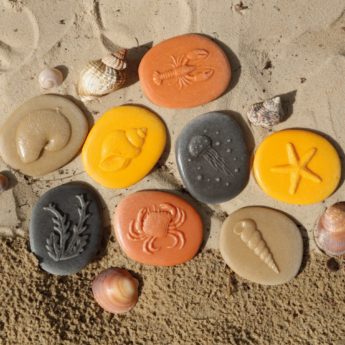 Set of eight ocean-themed stones made from a durable stone mix