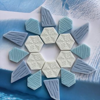 A collection of polar-inspired play stones (iceberg, ice sheet and snowflakes) made from a durable stone mix