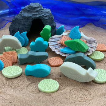 Ocean play habitat for storytelling adventures with animal figures, play cave and scenery stones