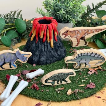 stone play volcano with wooden dinosaurs