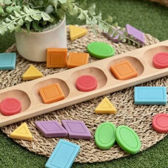 Colourful shape stones on a coir mat