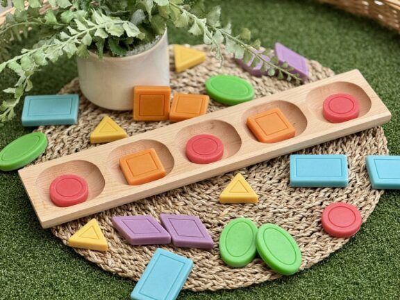 Colourful shape stones on a coir mat