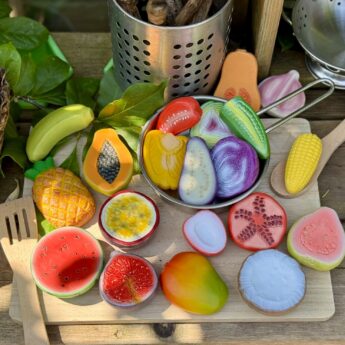 World Kitchen Sensory Play Stones on chopping board