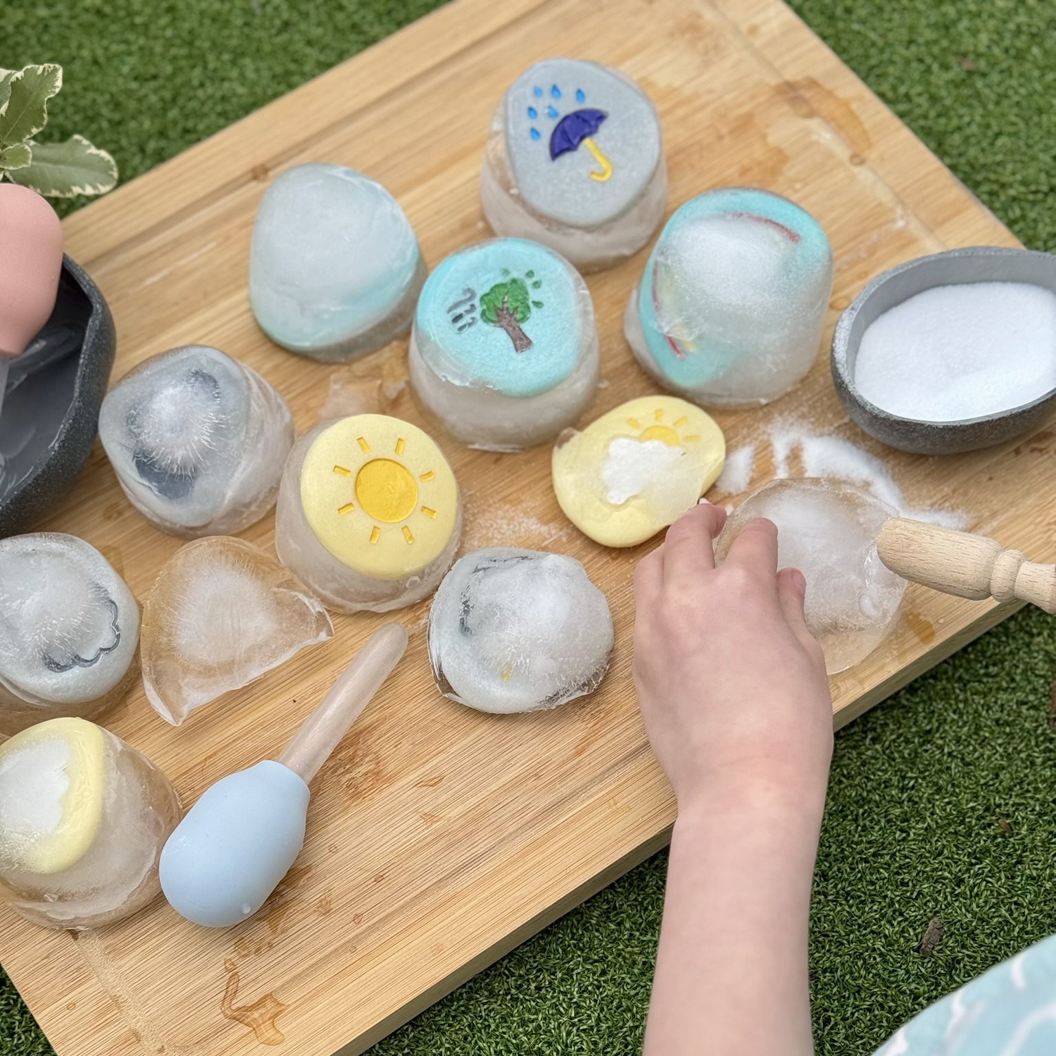 Science experiment to unfreeze weather stones with water and salt