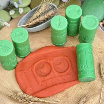 let's roll farm set of 6 green rollers with hen house pattern rolled on orange dough