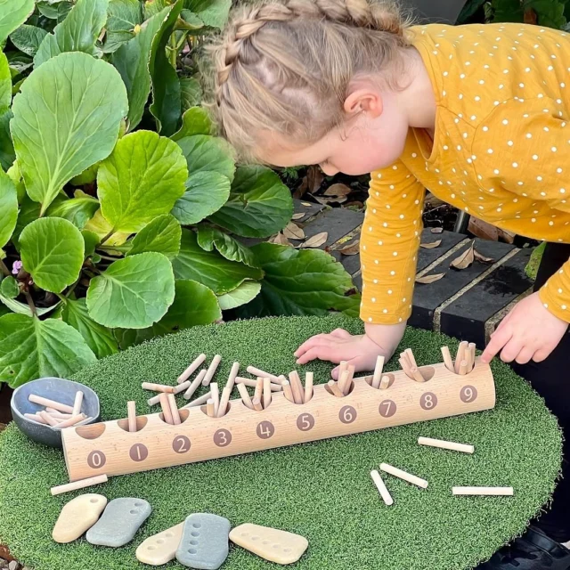 🌟 Happy National Numeracy Day! 🌟

Today we celebrate the everyday magic of numbers — from simple counting to solving real-life problems, numeracy is a vital skill that helps us make sense of the world.

To mark the occasion, we’re bringing learning to life with the Natural Counting Log — a beautifully simple and tactile way to explore numbers. 🌿✨

Children use this wooden log, with its evenly spaced holes, to count out sticks from a pile — physically placing the correct number in each hole. This hands-on activity helps children see and feel the value of numbers, building a solid foundation for understanding cardinality (knowing that the last number counted tells you how many there are).

📚 Why we love it:
	•Encourages independent, active learning
	•Strengthens fine motor skills
	•Makes abstract number concepts concrete and  meaningful
	•Invites connection with nature and play

#NationalNumeracyDay

 #earlymathsfun #earlymaths #yellowdooreducation #eyfs #yellowdoorplay #learningthroughplay #playbasedlearning #earlymath #numbersense #earlymathskills