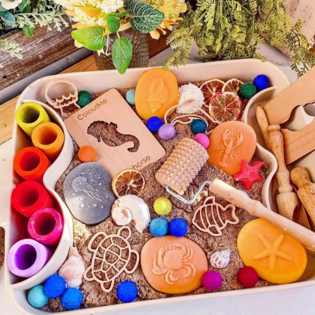 How beautiful is this sandy setup by @mylittlegirltribe? 🌊🐚
We love seeing our Seashore Stones used in such a fun and inviting way - surrounded by hidden treasures just waiting to be discovered!

This sensory tray is a perfect blend of play and learning, encouraging little ones to dig, explore, and spark conversations about the wonders of the coast. A wonderful way to bring the beach indoors and let imaginations run wild! 🦀🌊 

#sensoryplaytray #earlyyearsplay #yellowdooreducation #learningthroughplay  #natureinspiredplay #loosepartsplay  #sensoryplayideas